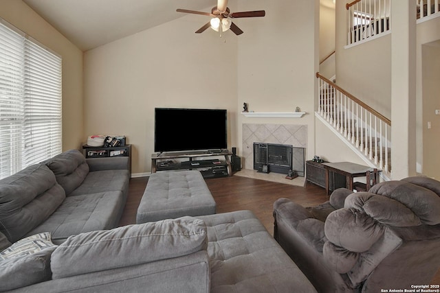 6139 Diego Ln, San Antonio, TX 78253 - living room with a ceiling fan, high vaulted ceiling, wood finished floors, stairs, and a tile fireplace