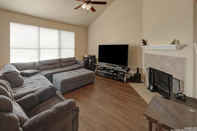 6139 Diego Ln, San Antonio, TX 78253 - living room with ceiling fan, a fireplace, high vaulted ceiling, and wood finished floors