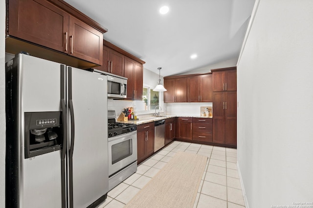 2827 Bent Bow, San Antonio, TX 78209 - kitchen with stainless steel appliances, a sink, lofted ceiling, light tile patterned flooring, and hanging light fixtures