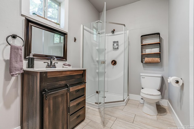 719 W Elsmere, San Antonio, TX 78212 - bathroom featuring a stall shower, toilet, vanity, and baseboards