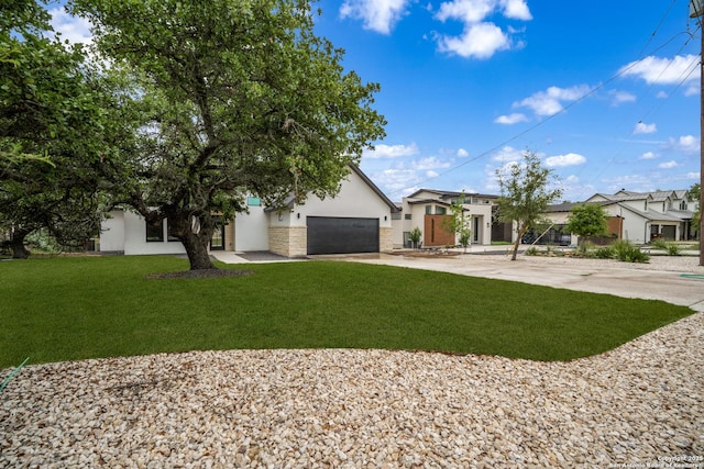 25822 Mount Carillon, San Antonio, TX 78260 - view of front of house with stucco siding, driveway, a front yard, and a garage