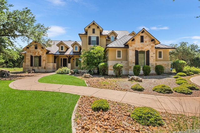 102 Arroyo, Boerne, TX 78006 - view of front of property featuring a standing seam roof, stone siding, and metal roof