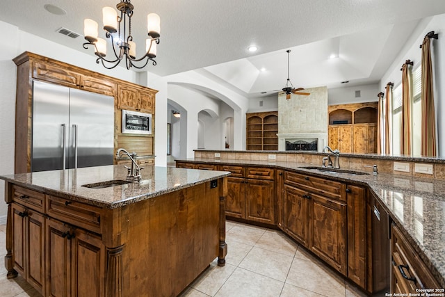 102 Arroyo, Boerne, TX 78006 - kitchen featuring a sink, built in appliances, a ceiling fan, a fireplace, and recessed lighting