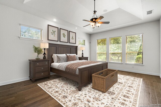 102 Arroyo, Boerne, TX 78006 - bedroom with dark wood-type flooring, multiple windows, baseboards, and recessed lighting