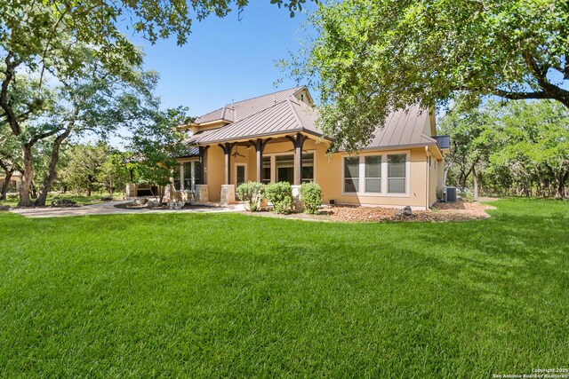102 Arroyo, Boerne, TX 78006 - back of house with a standing seam roof, ceiling fan, and metal roof