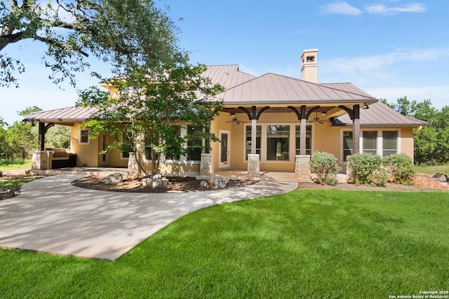 102 Arroyo, Boerne, TX 78006 - rear view of property with a standing seam roof, ceiling fan, metal roof, and stucco siding