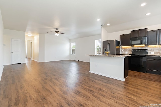 kitchen with black appliances, backsplash, a center island, dark wood-style floors, and a ceiling fan