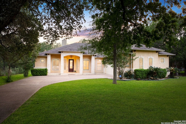 19015 Seminole Pass, Garden Ridge, TX 78266 - view of front of property featuring concrete driveway, a front yard, a chimney, and a garage