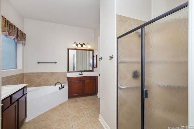 19015 Seminole Pass, Garden Ridge, TX 78266 - full bath featuring a garden tub, a shower stall, two vanities, and tile patterned flooring
