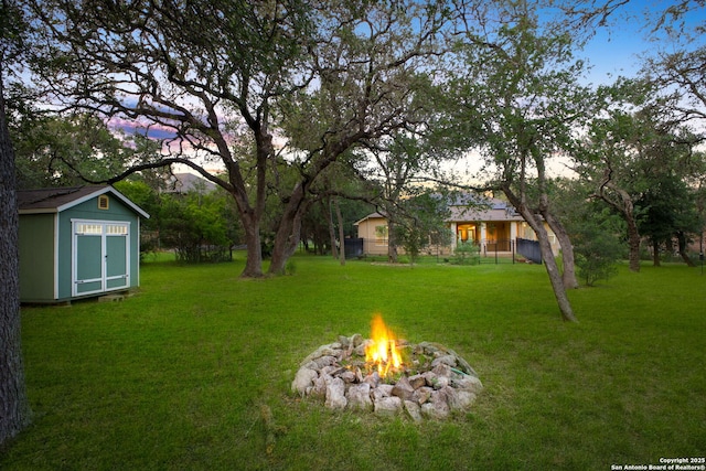 19015 Seminole Pass, Garden Ridge, TX 78266 - view of green lawn featuring an outdoor fire pit