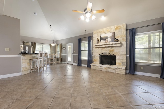 212 Leather Leaf, Boerne, TX 78006 - tiled living room with ceiling fan, baseboards, a fireplace, and high vaulted ceiling