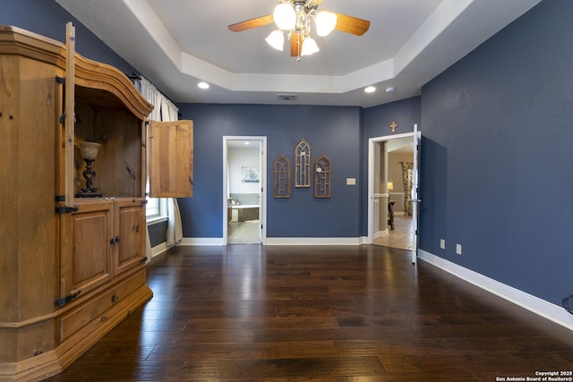 212 Leather Leaf, Boerne, TX 78006 - unfurnished living room featuring ceiling fan, wood finished floors, baseboards, recessed lighting, and a tray ceiling