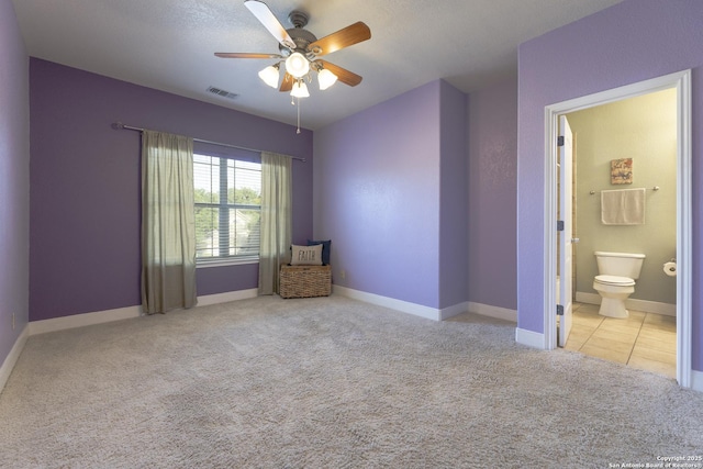 212 Leather Leaf, Boerne, TX 78006 - unfurnished bedroom featuring carpet flooring, baseboards, ensuite bathroom, and ceiling fan