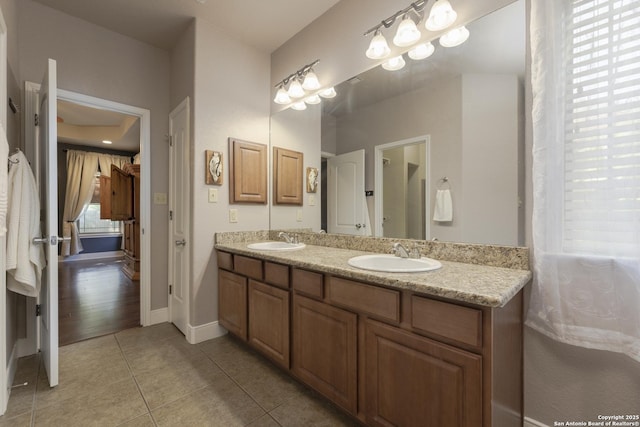212 Leather Leaf, Boerne, TX 78006 - bathroom featuring tile patterned flooring, double vanity, and baseboards