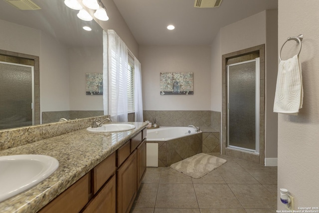 212 Leather Leaf, Boerne, TX 78006 - bathroom with tile patterned flooring, a bath, a stall shower, double vanity, and recessed lighting