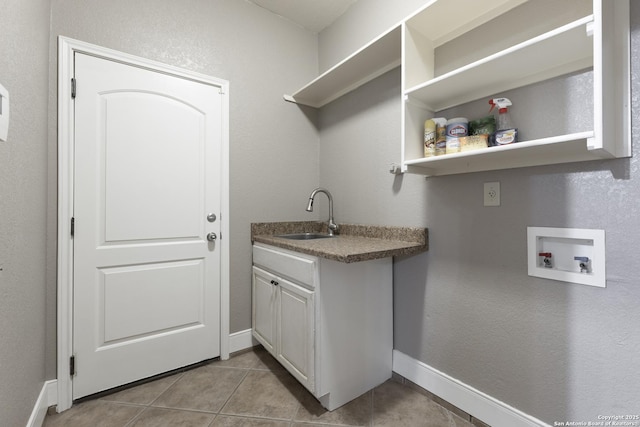 212 Leather Leaf, Boerne, TX 78006 - washroom featuring hookup for a washing machine, tile patterned floors, baseboards, and cabinet space