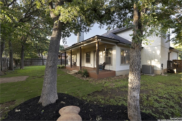 212 Leather Leaf, Boerne, TX 78006 - view of side of property with a chimney, stucco siding, central air condition unit, and a patio area