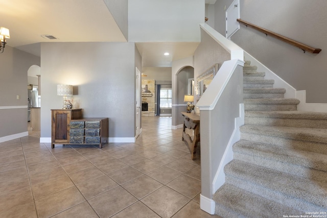 212 Leather Leaf, Boerne, TX 78006 - foyer entrance with arched walkways, light tile patterned floors, stairs, and baseboards