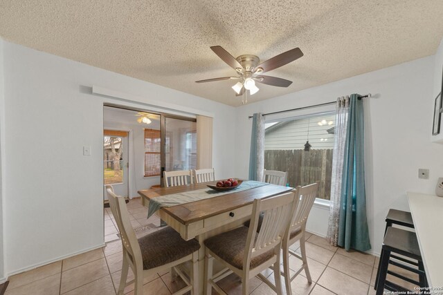 718 Cypressgreen, San Antonio, TX 78245 - dining room with a ceiling fan, light tile patterned flooring, plenty of natural light, and a textured ceiling
