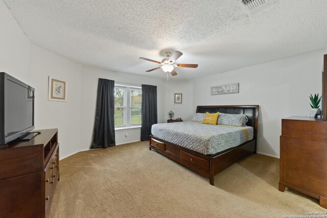 718 Cypressgreen, San Antonio, TX 78245 - bedroom featuring light carpet, a textured ceiling, ceiling fan, and baseboards