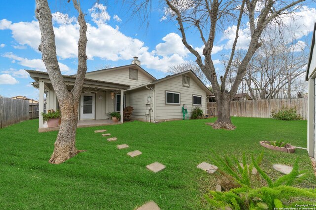 718 Cypressgreen, San Antonio, TX 78245 - back of property featuring a patio and a chimney