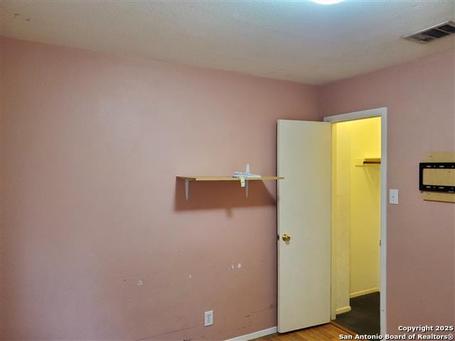 4218 Swan Frst, San Antonio, TX 78222 - empty room with baseboards and wood finished floors