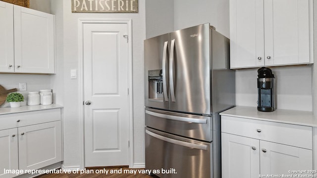 5026 Wichita Pike, San Antonio, TX 78253 - kitchen featuring stainless steel refrigerator with ice dispenser, white cabinetry, light countertops, and wood finished floors