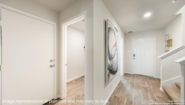 7314 Perseus Brk, San Antonio, TX 78252 - laundry area with light wood-style flooring and baseboards