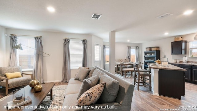 7314 Perseus Brk, San Antonio, TX 78252 - living room featuring plenty of natural light, light wood-style flooring, recessed lighting, and baseboards