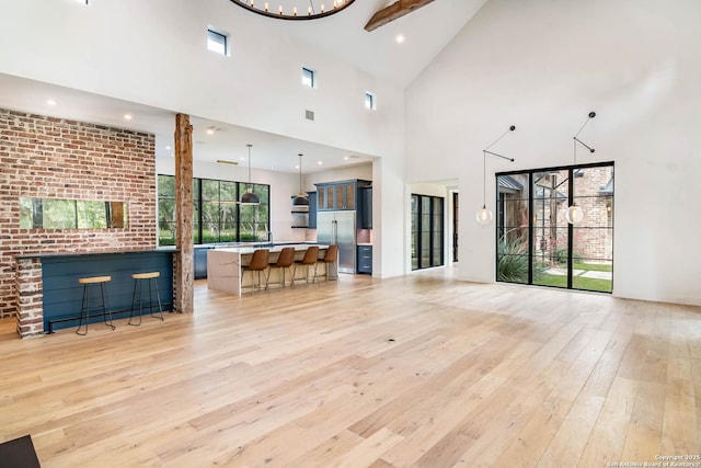 185 Southfield, Boerne, TX 78006 - living room featuring light wood-style floors, high vaulted ceiling, recessed lighting, and a chandelier