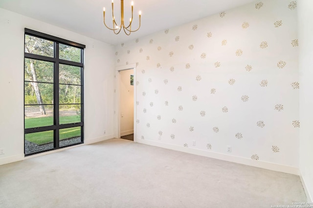 185 Southfield, Boerne, TX 78006 - unfurnished room featuring a chandelier, light colored carpet, baseboards, and wallpapered walls