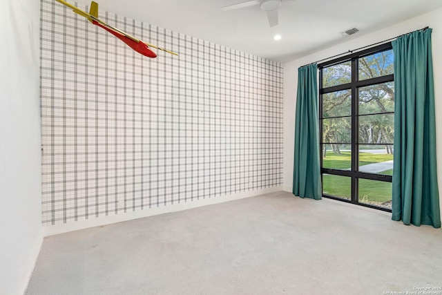 185 Southfield, Boerne, TX 78006 - carpeted spare room with wallpapered walls, a ceiling fan, and an accent wall