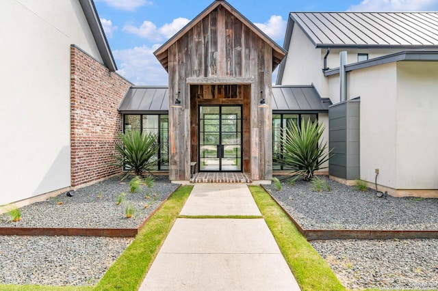 185 Southfield, Boerne, TX 78006 - view of exterior entry featuring a standing seam roof, metal roof, and stucco siding