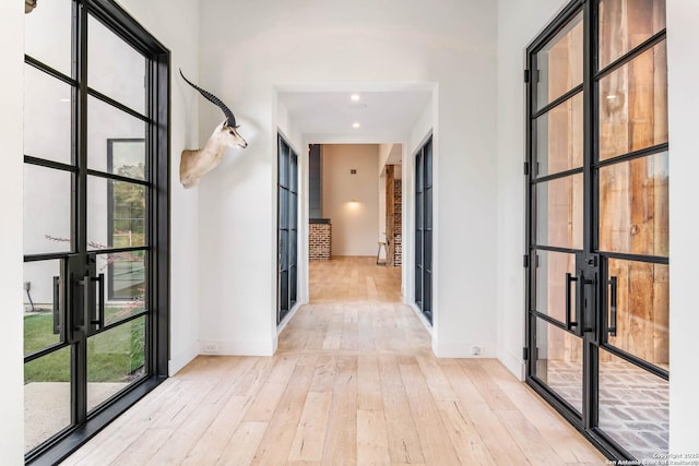 185 Southfield, Boerne, TX 78006 - corridor with light wood-type flooring, baseboards, french doors, and recessed lighting