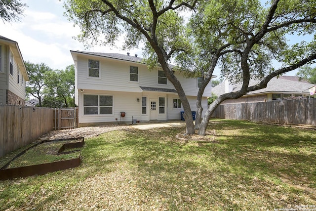 back of property with a patio