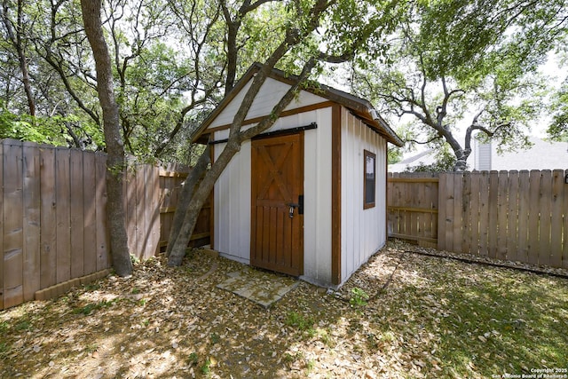 view of shed featuring a fenced backyard