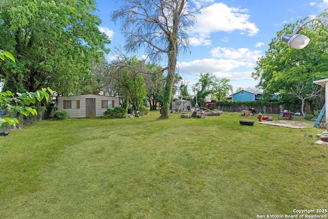 3742 Weir Ave, San Antonio, TX 78226 - view of yard featuring an outbuilding and a patio