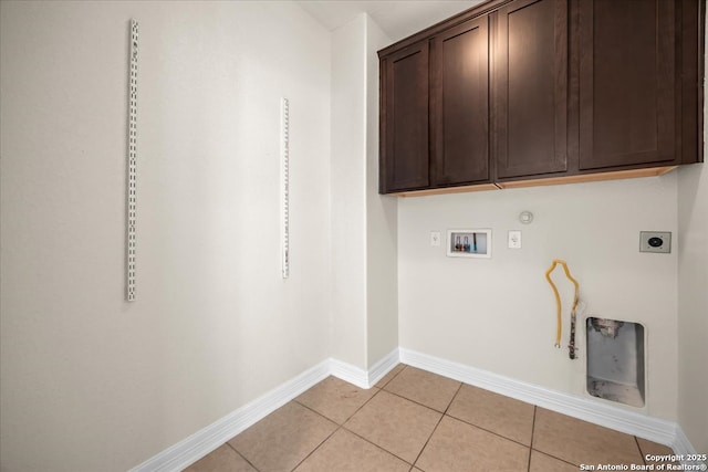 12627 Alamito Crk, San Antonio, TX 78254 - laundry room featuring gas dryer hookup, hookup for a washing machine, baseboards, light tile patterned floors, and hookup for an electric dryer