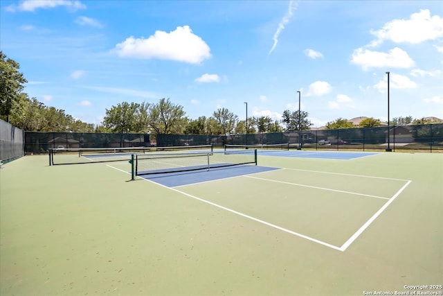 12627 Alamito Crk, San Antonio, TX 78254 - view of tennis court with community basketball court and fence