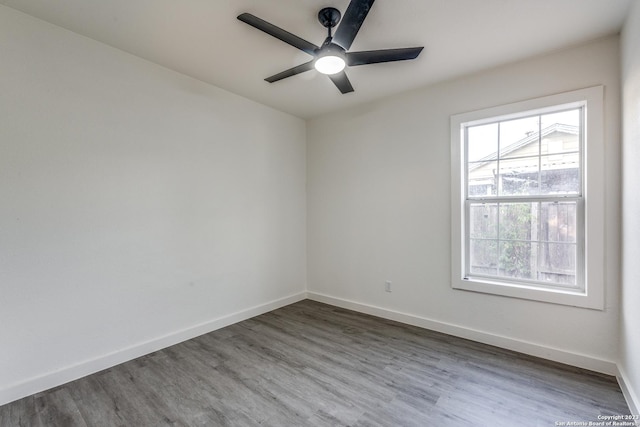 827 Ware Blvd, San Antonio, TX 78214 - spare room featuring wood finished floors, baseboards, and ceiling fan