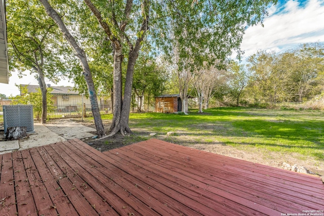 827 Ware Blvd, San Antonio, TX 78214 - wooden terrace with an outbuilding, a shed, and a patio area