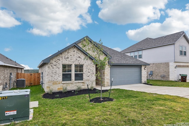 12734 Tegea Pass, San Antonio, TX 78245 - view of front of home with concrete driveway, an attached garage, cooling unit, brick siding, and roof with shingles