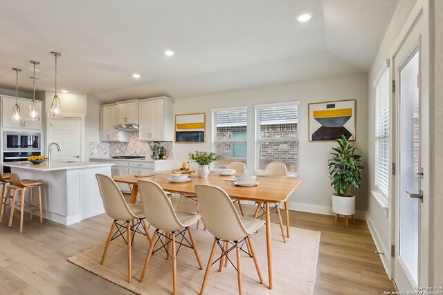 12734 Tegea Pass, San Antonio, TX 78245 - dining room featuring light wood-style flooring, recessed lighting, and baseboards