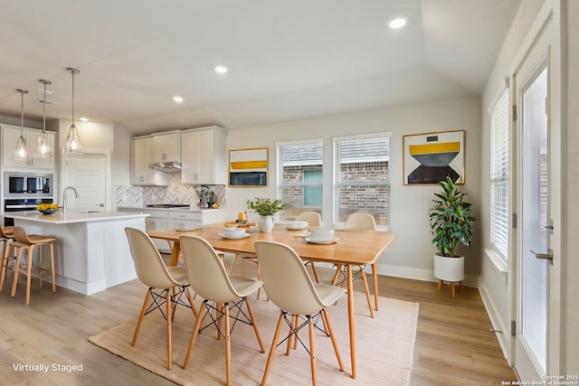12734 Tegea Pass, San Antonio, TX 78245 - dining room with light wood finished floors, recessed lighting, and baseboards