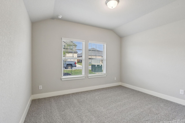 12734 Tegea Pass, San Antonio, TX 78245 - unfurnished room with carpet, lofted ceiling, and baseboards
