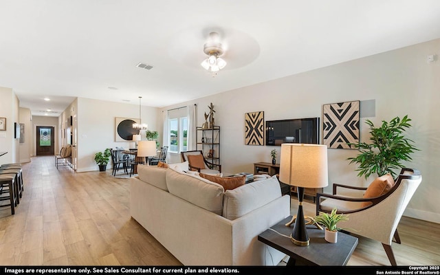 189 Kayla Ave, San Antonio, TX 78253 - living area featuring light wood-style floors, baseboards, and a ceiling fan