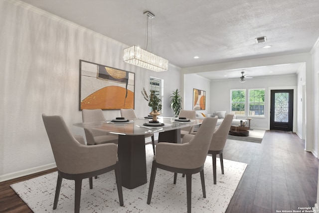 140 E Dullnig, San Antonio, TX 78223 - dining area featuring baseboards, a chandelier, wood finished floors, ornamental molding, and recessed lighting