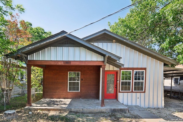 140 E Dullnig, San Antonio, TX 78223 - view of front of house featuring fence and board and batten siding