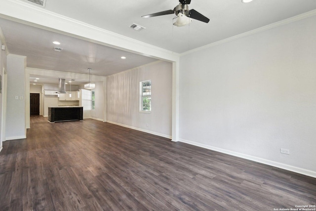 140 E Dullnig, San Antonio, TX 78223 - unfurnished living room featuring a ceiling fan, crown molding, dark wood-style floors, baseboards, and recessed lighting