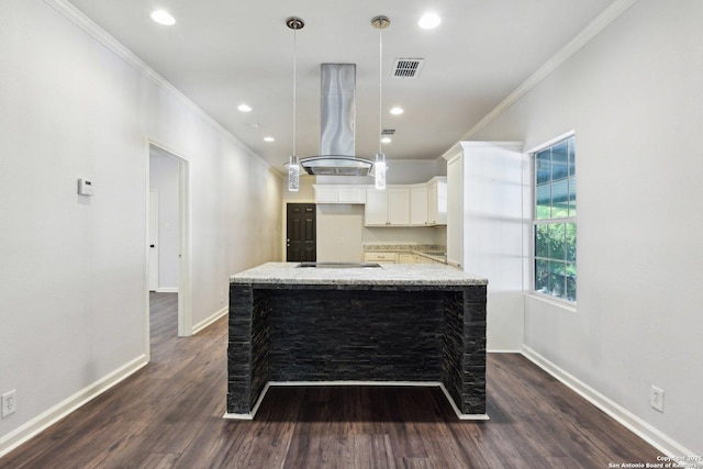 140 E Dullnig, San Antonio, TX 78223 - kitchen featuring crown molding, baseboards, island range hood, dark wood-type flooring, and white cabinets